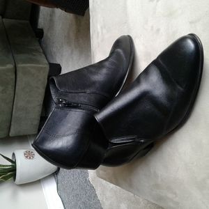 Black zippered leather ankle bootie